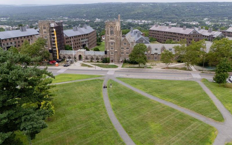Opinion surveys case study: aerial view of historic university buildings and green lawns