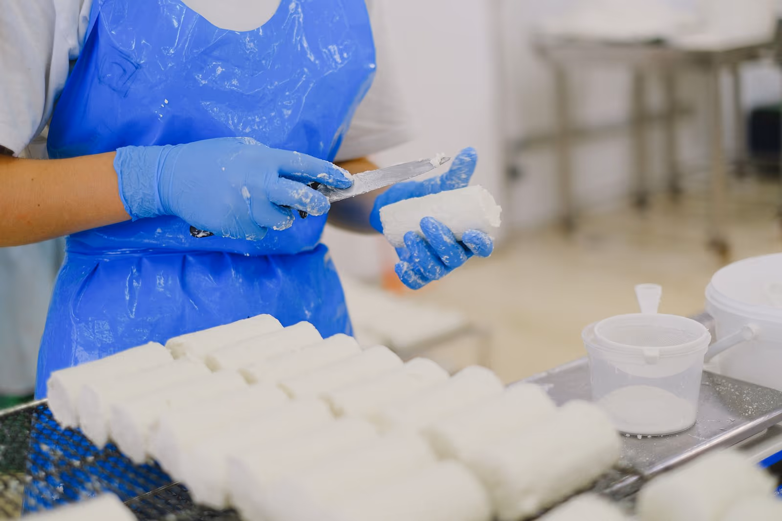 A worker on a food processing line