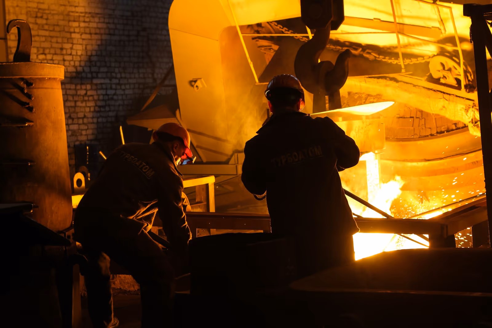 Workers on a steel plant floor