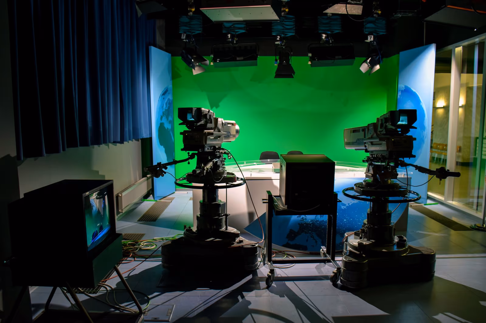 A television studio floor set with cameras
