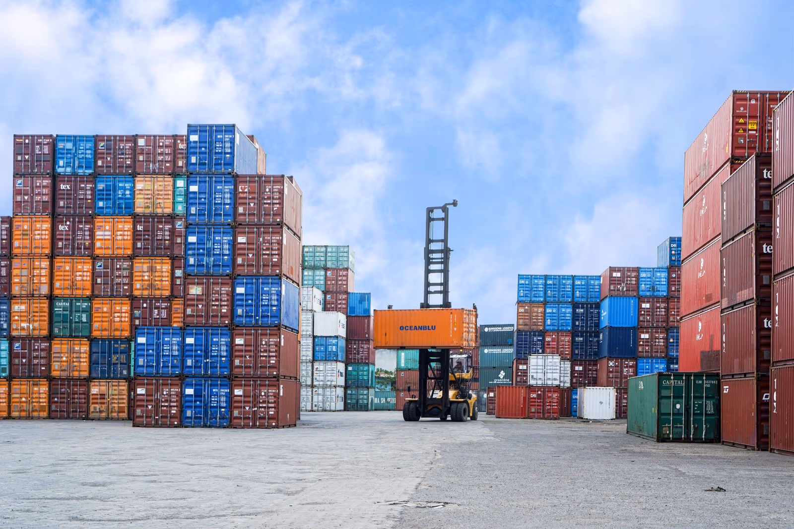 Shipping containers stacked high at a port