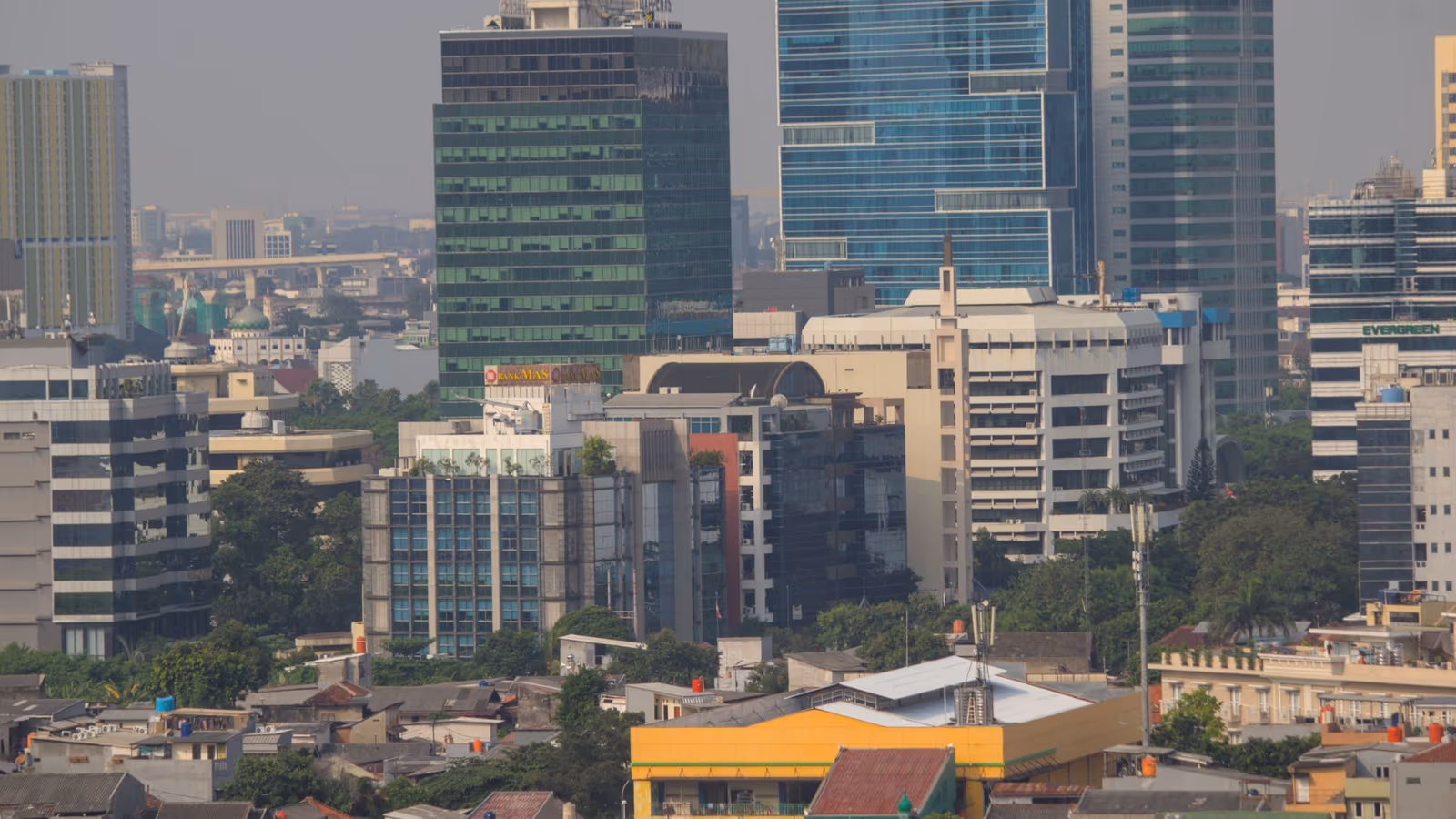 A dense city skyline of high-rise towers