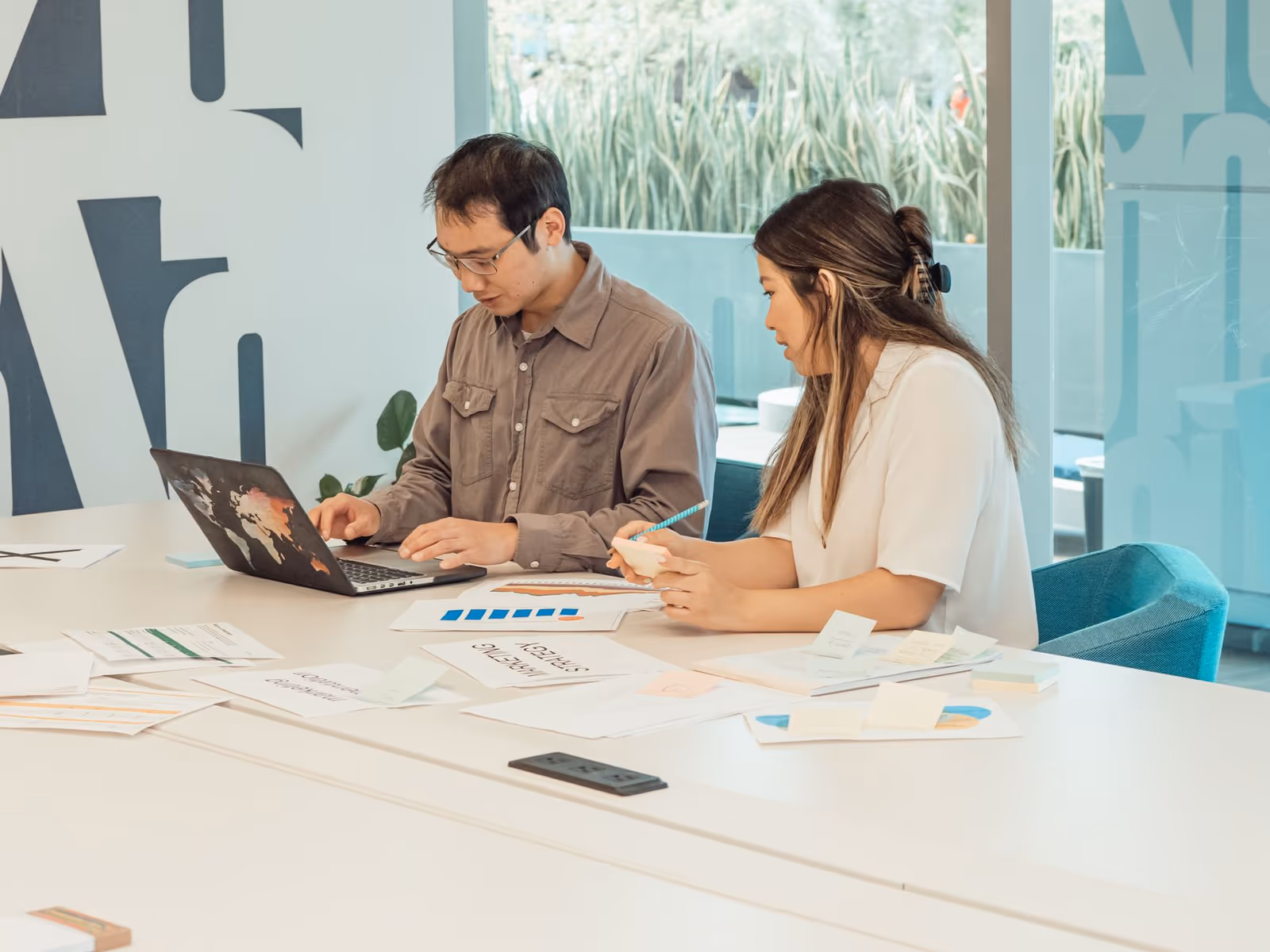 Two colleagues working through a model together
