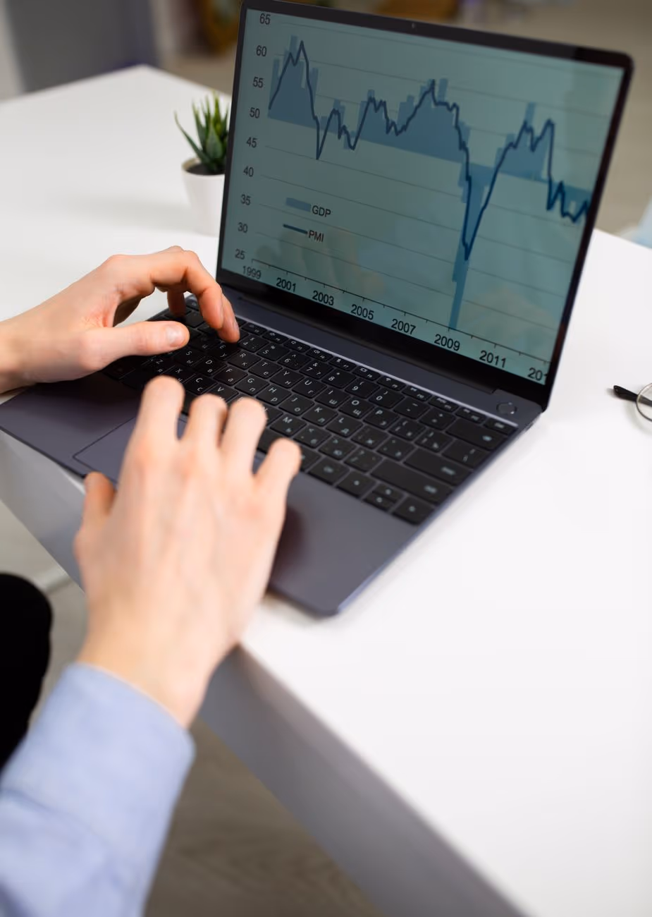 An insights analyst working across several screens