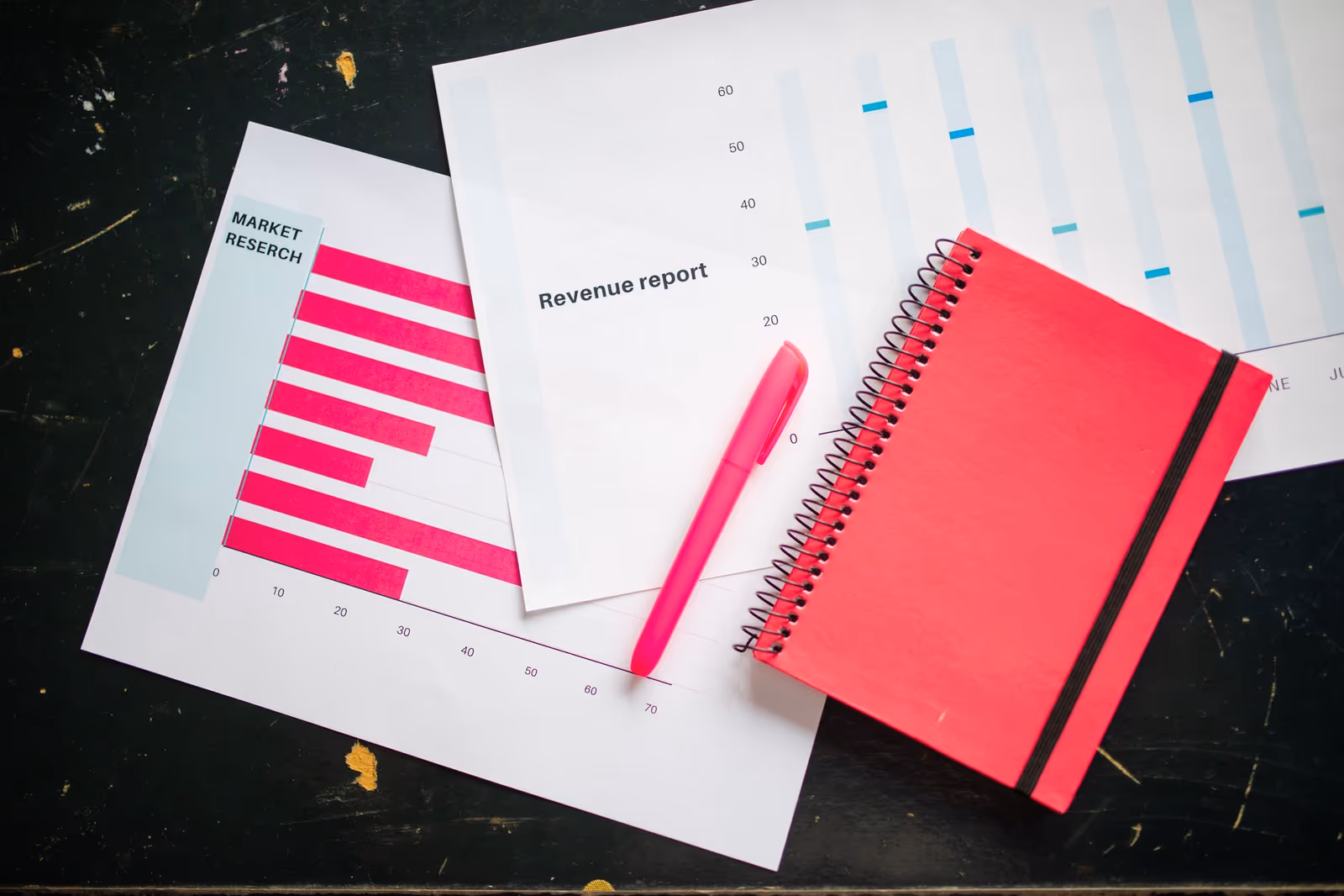 Charts and working notes laid out on a desk