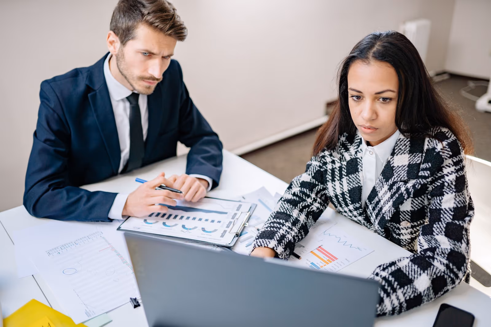 Two researchers reviewing a study together