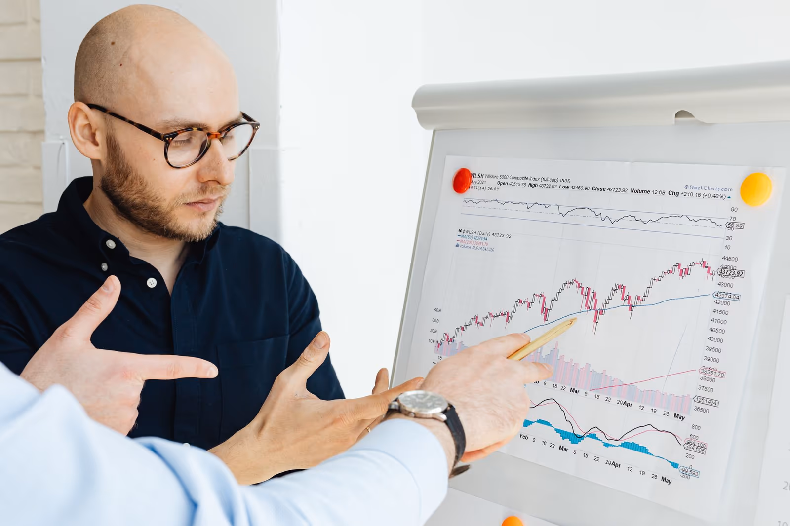 Two researchers reviewing survey results together