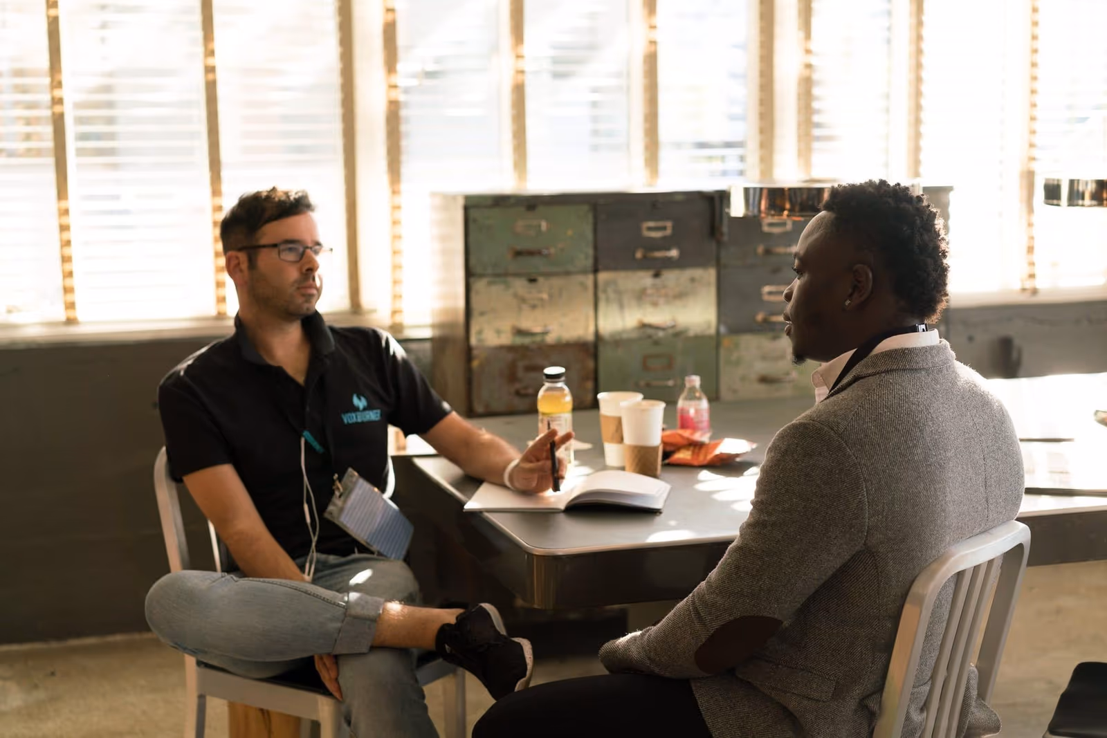 Two professionals in a focused conversation