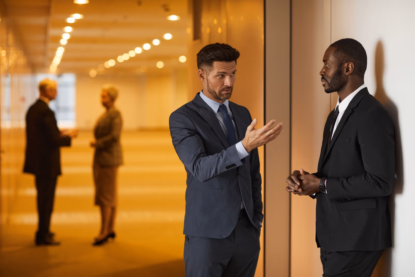 Two colleagues in discussion after a session