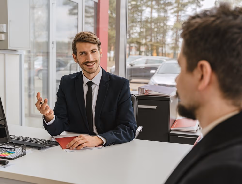 Two colleagues comparing notes on a decision