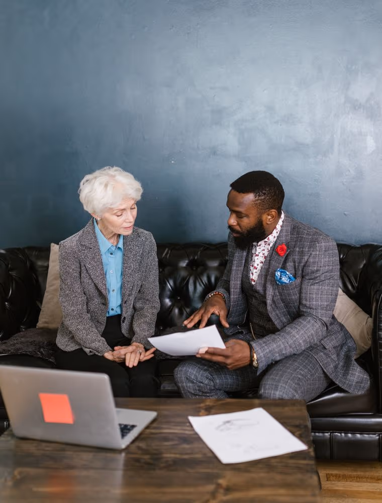 Two researchers working through documents