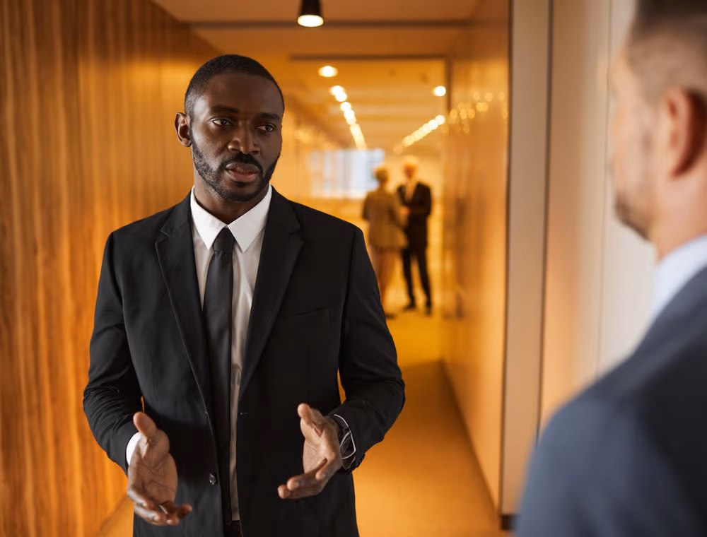 Two colleagues comparing notes on a decision