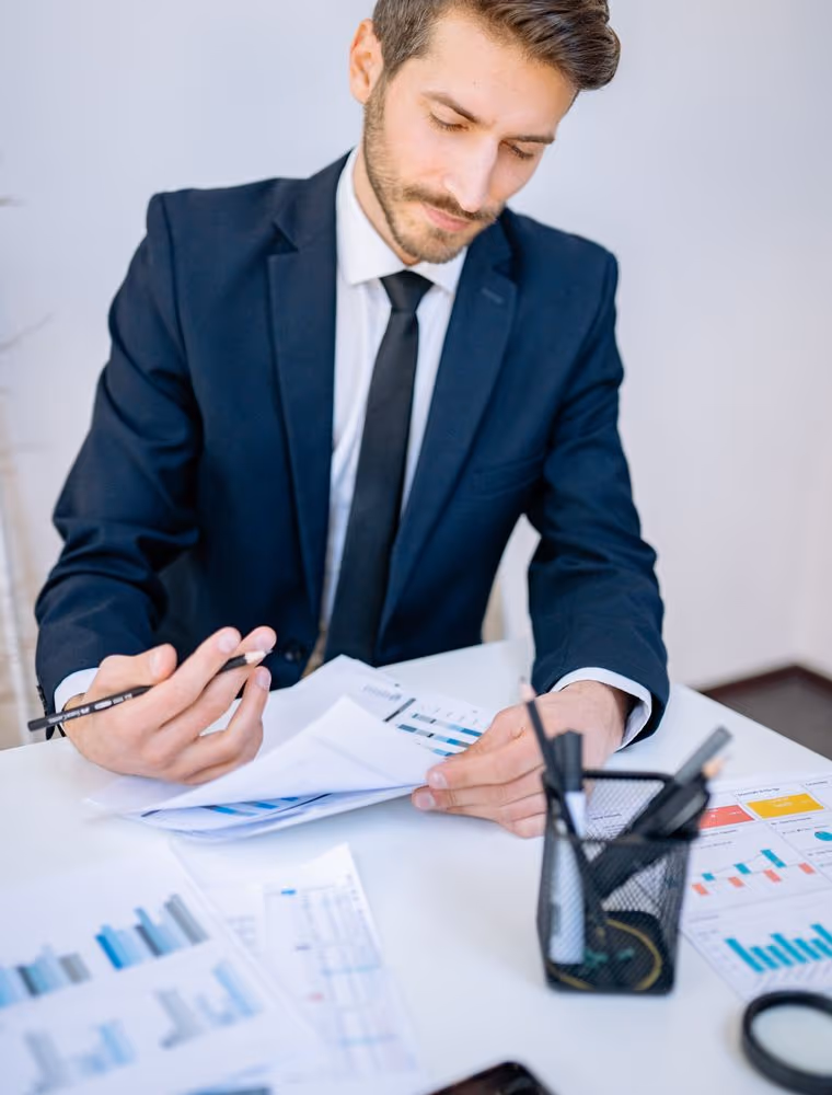 Two analysts reviewing figures in an office
