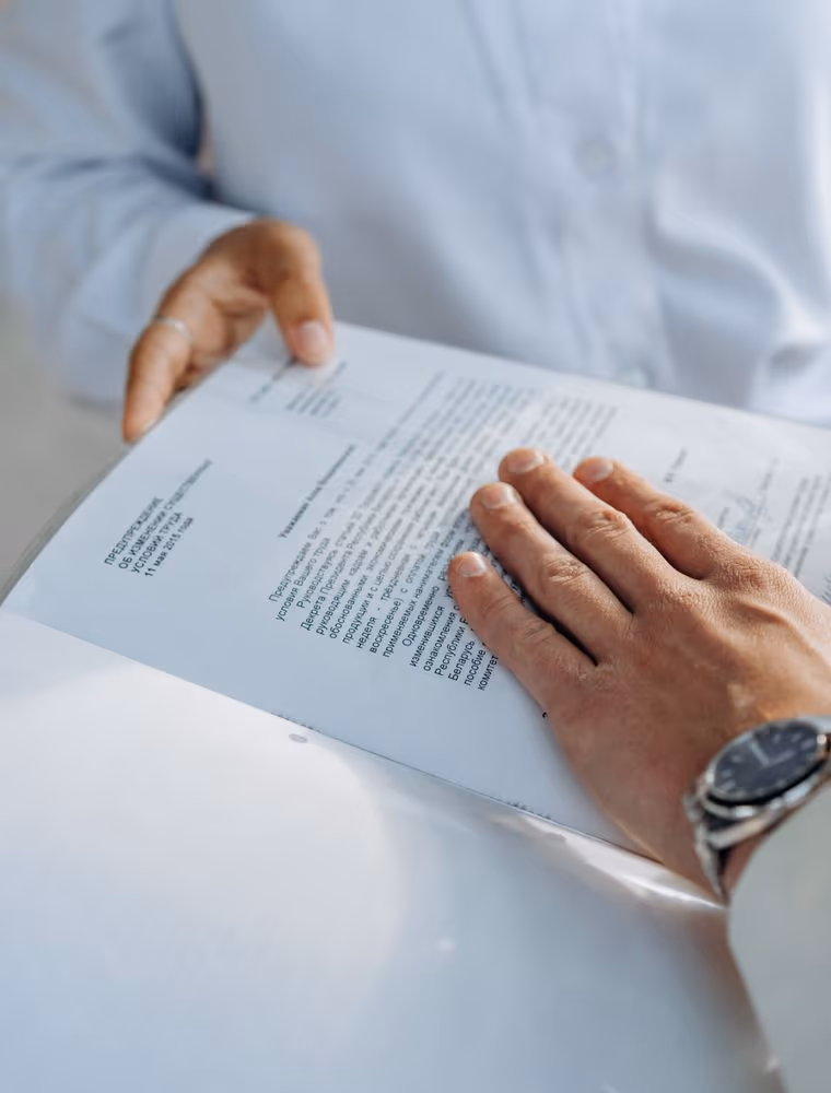 Two corporate executives reviewing a contract