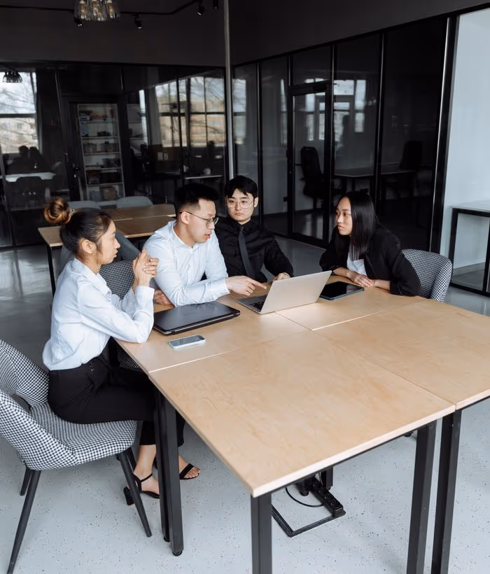 A case team meeting around a table