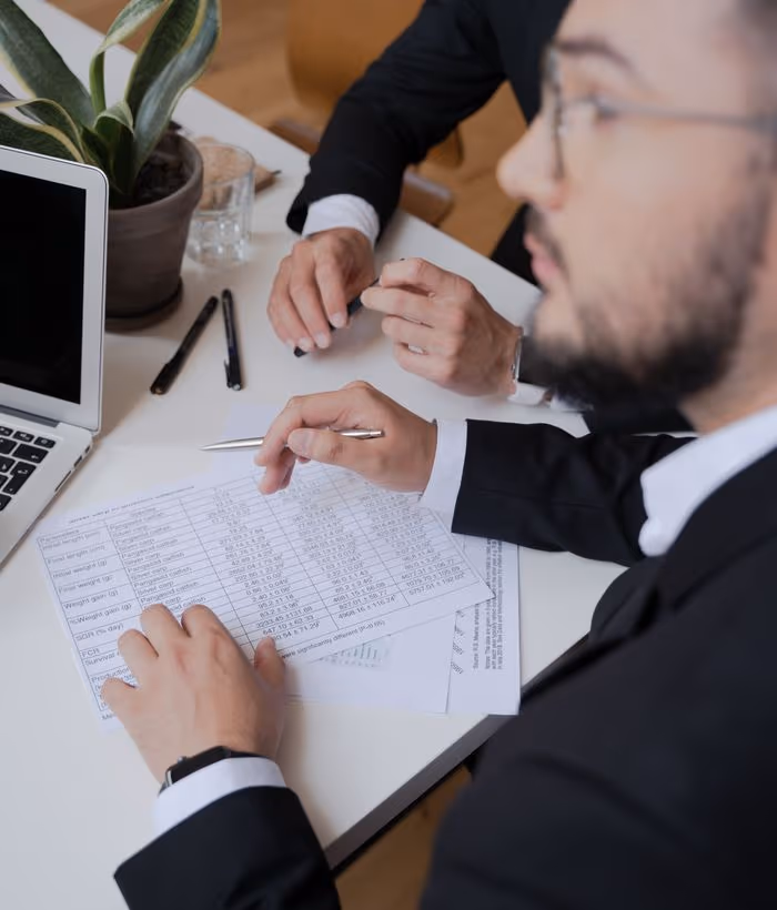 A deal team meeting in a conference room